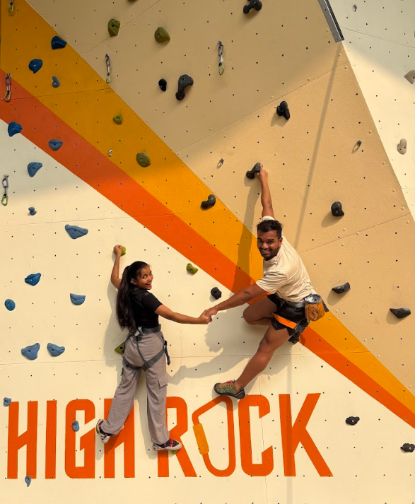 Rock climbing with partner on wall