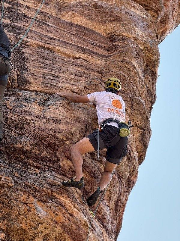 badami climber on red sandstone
