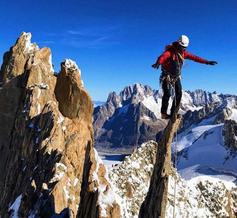 Kapil Harit, ENSA-certified mountain guide, on a mountain summit
